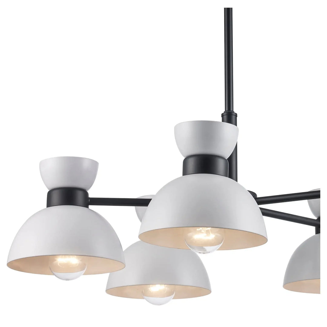 Modern five-light chandelier with white and black dome shades ideal for dining room or living area lighting