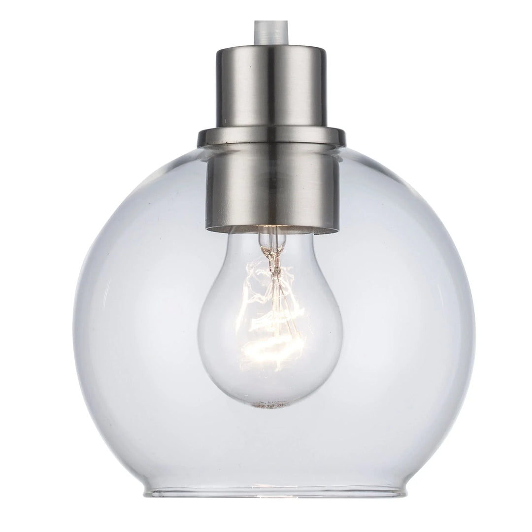 Pendant light fixture with clear glass globe shade and brushed nickel finish for modern interiors