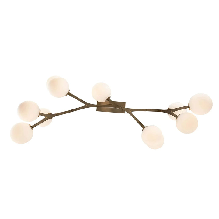 Modern ceiling pendant light with angled brass arms and eight globe bulbs for living room lighting